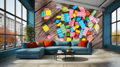 Original candy to children on the wooden background Wall mural