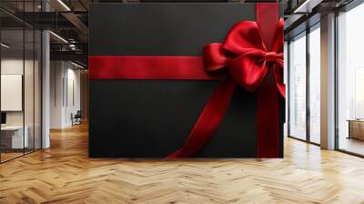 Red Satin Ribbon Bow on a Black Background Wall mural