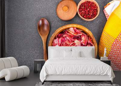 Salad of cabbage, carrots, beets and butter in a wooden bowl, re Wall mural