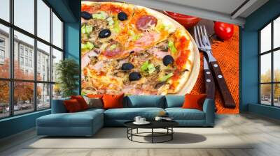 Six slices of pizza with different toppings on wooden board Wall mural