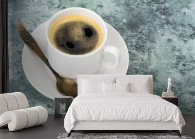 White cup with black espresso coffee on blue and gray background Wall mural