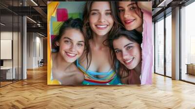 Group of smiling young women framed by colorful torn paper, perfect for friendship, lifestyle, and vibrant social media content Wall mural