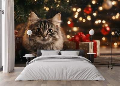 American Bobtail cat relaxing by the Christmas tree surrounded by festive decorations and gifts Wall mural