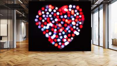 Blurred red, white and gray confetti in the shape of a heart with bokeh effect on a black background (Valentines Day backdrop) Wall mural