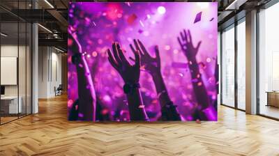 Close up photo of many party people dancing purple lights confetti flying everywhere nightclub event hands raised up wear shiny clothes Wall mural