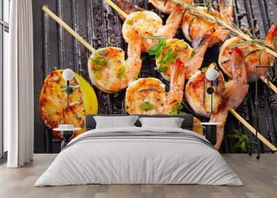 grilled shrimp on skewers. Grilled seafood on skewers with spices, herbs and lemon. delicious prawn. Grill. The iron grill. close up Wall mural