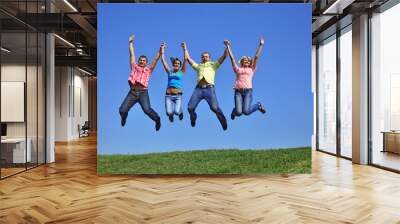 Big group of young jumping people with hands up Wall mural