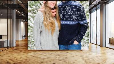 happy smiling couple in winter forest Wall mural