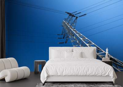 Steel electricity pylon on bright blue sky Wall mural