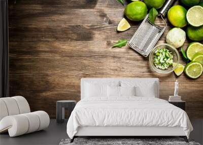 Fresh limes with grater and zest. Wall mural