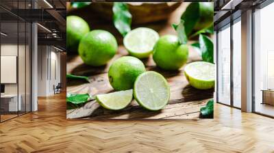 Fresh limes. On wooden table. Wall mural