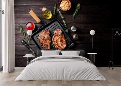 Grilled pork steak in a frying pan.  Wall mural