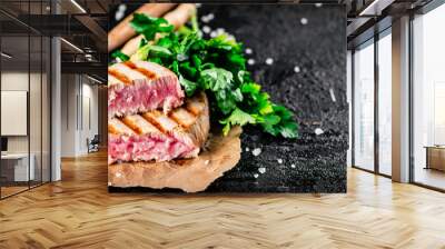 Grilled tuna with parsley on the table.  Wall mural