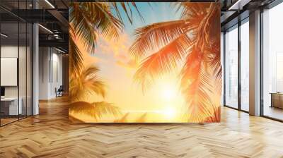 Summer vacation banner. Romantic vibes of tropical palm tree sunlight on sky background. Outdoor sunset exotic foliage closeup nature landscape. Coconut palm trees shining sun over bright sky panorama Wall mural