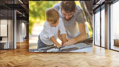 The boy and the father fixing a car Wall mural