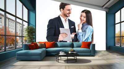 The business couple with a tablet standing on the white background Wall mural