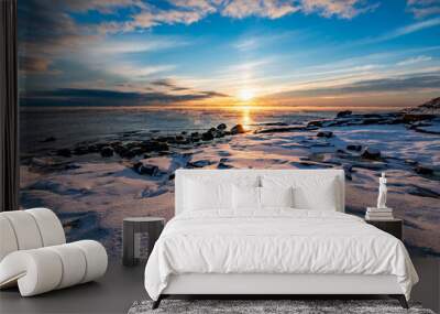 The coast of the Gulf of Finland in winter at sunset Wall mural