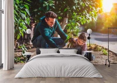 The father and son planting a tree Wall mural