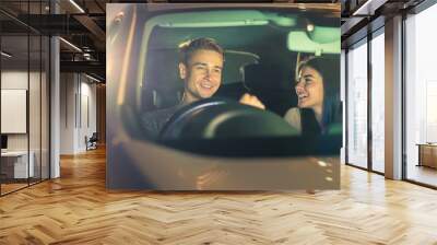 The happy couple drive a car. evening night time Wall mural