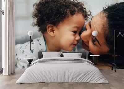 Close up portrait of a young mom and her son Wall mural