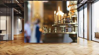 Close-up of candles in the church before the wedding ceremony. Wall mural