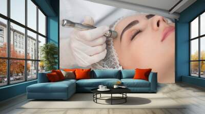 Diamond microdermabrasion, peeling cosmetic. woman during a microdermabrasion treatment in beauty salon Wall mural