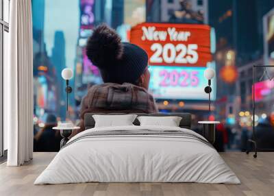 girl looking at display showing letters New Year 2025 at NYC Times Square, holiday celebration Wall mural