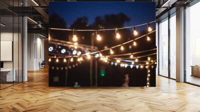 A garland of light bulbs in the decoration of the night ceremony Wall mural