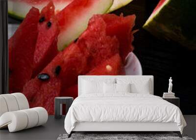 Sliced ripe red watermelon isolated on black background cutout Wall mural