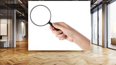 Female hand holding the magnifying glass (isolated) Wall mural