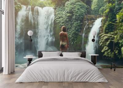 Woman at waterfalls in jungles, Bali island nature, stream cascade, Indonesia travel, beautiful jungle Wall mural