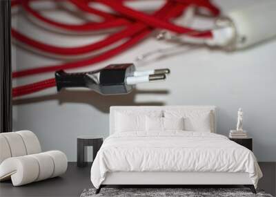 Electricity cord covered in red fabric Wall mural