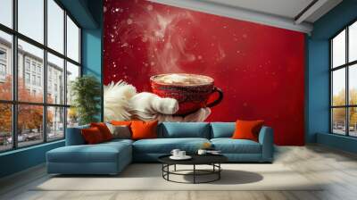 A Santa's hand holding a cup of steaming hot chocolate Wall mural