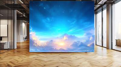 Dramatic blue sky with clouds and a bright glow in the distance. Wall mural