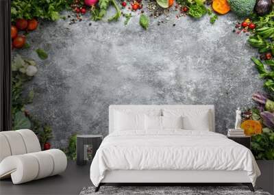 A border of colorful vegetables, aromatic herbs, and spices framing a gray stone background, perfect for culinary content with space for copy. Wall mural