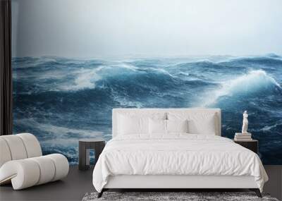 A close-up of rain-swept ocean waves with high winds whipping up the surface, highlighting the chaotic and intense conditions of a storm at sea. Wall mural