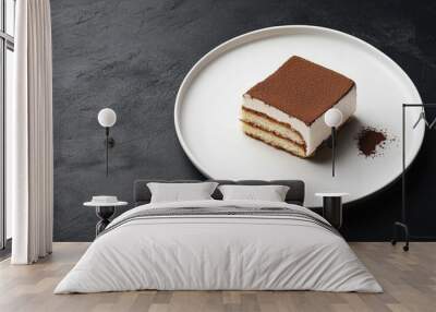 A slice of Tiramisu on a simple white plate, elegantly arranged on a dark background, with generous copy space around it for captions or product descriptions. Wall mural