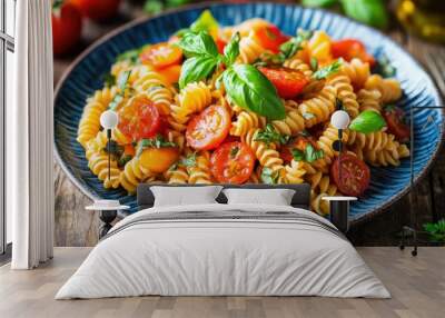 A vibrant plate of delicious pasta tossed with ripe tomatoes and fresh basil, drizzled with olive oil, beautifully styled on a rustic wooden table, inviting the viewer to enjoy its colorful appeal. Wall mural