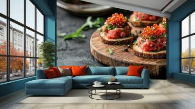 Elegant canap with tender raw beef tartar, salmon red caviar, and brioche, arranged on a rustic wooden board. Wall mural