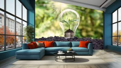 Tree grows in light bulbs, energy-saving and environmental concepts on Earth Day. Wall mural