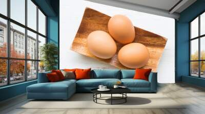 Eggs on white rustic wooden background Wall mural