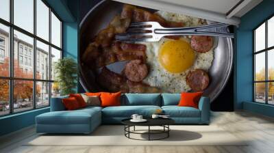 Breakfast of fried egg and bacon in metal dish Wall mural