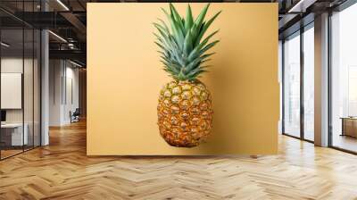 Fresh Ripe Pineapple Isolated Against Yellow Background for Tropical Themed Designs, Healthy Eating Concepts, and Summer Marketing Campaigns Wall mural