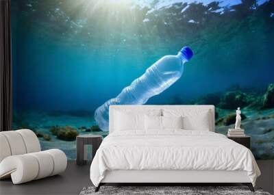 plastic bottle on the ocean floor, underwater Wall mural