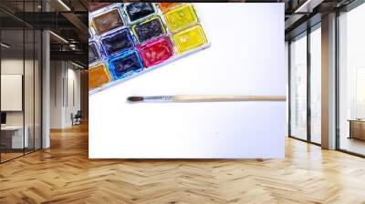 Palette with watercolors and brushes for paints on a white background. Watercolor paints. Brushes. Top and front view Wall mural