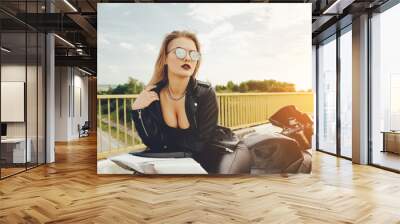 Biker girl in a leather clothes on a motorcycle Wall mural