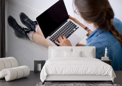 Close-up portrait of womans hands working on her laptop keyboard Wall mural