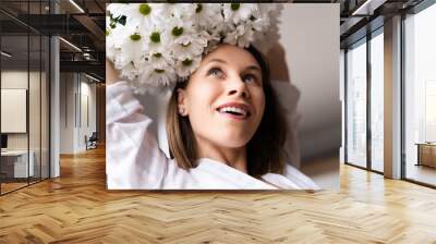 Young happy cheerful sweet lovely smiling woman enjoy a bouquet of white fresh flowers Wall mural