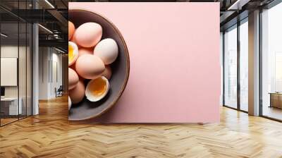 healthy fresh eggs in bowl with light pink background Wall mural