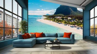 Luxury beach with mountain in Mauritius. Beach with palms and crystal ocean. Aerial view Wall mural